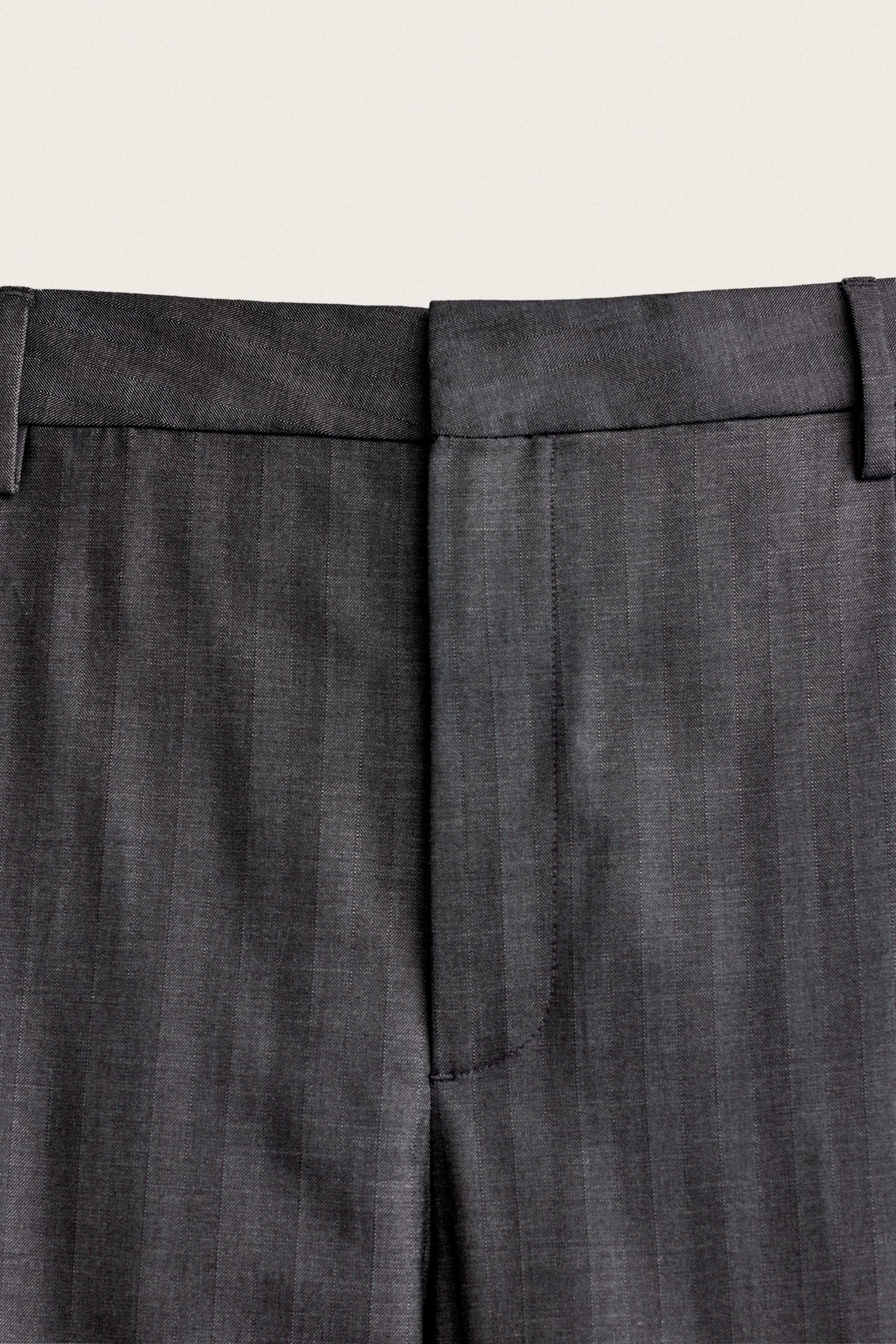 STRIPED PLEATED RELAXED FIT PANTS