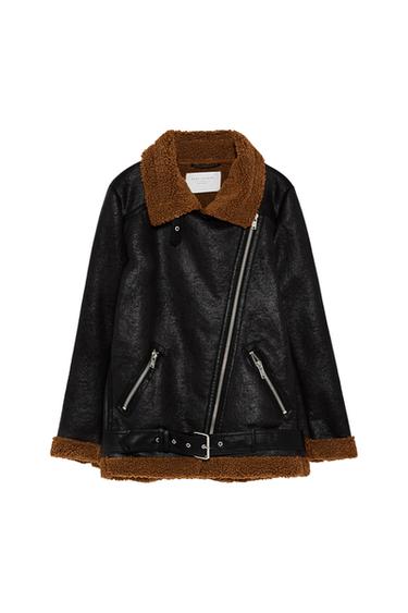 Front view of a black jacket with a diagonal zip, brown collar and cuffs, and side pockets with zips.