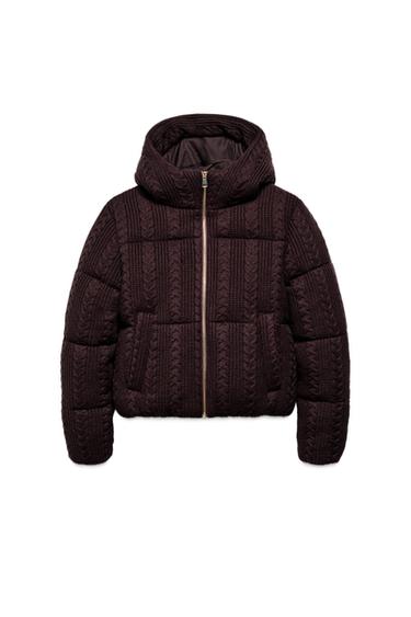 Front view of a burgundy anorak with a hood, central zip, front pockets and cable knit finish.