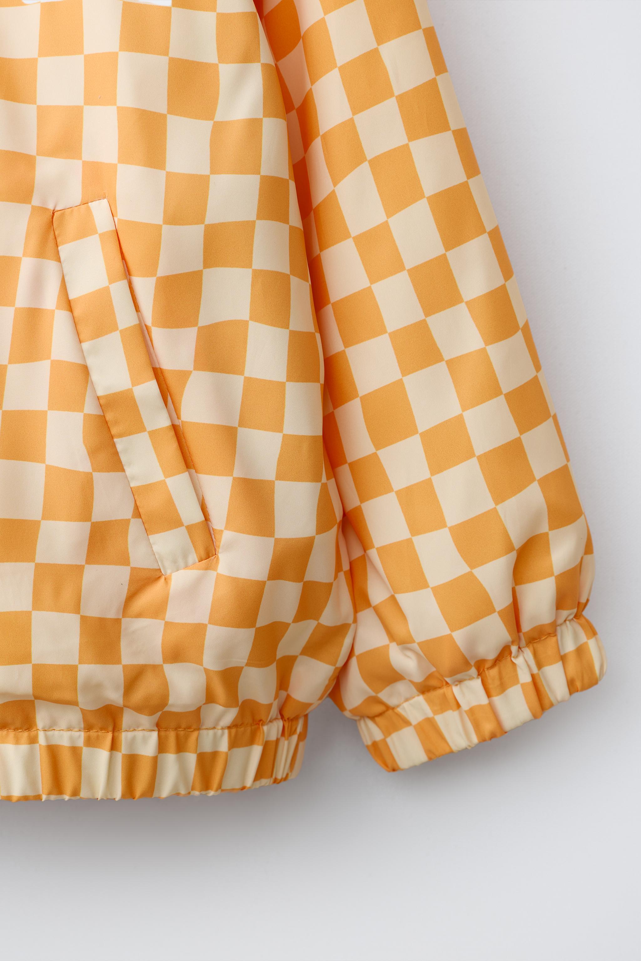 LIGHTWEIGHT CHECKERBOARD RAINCOAT