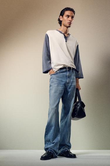 جينز بقصة فلير - أزرق وسط الخاص بـ Zara