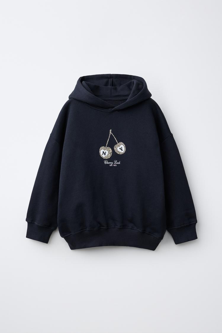 SUDADERA CAPUCHA ESTAMPADO CEREZAS ANIMAL PRINT