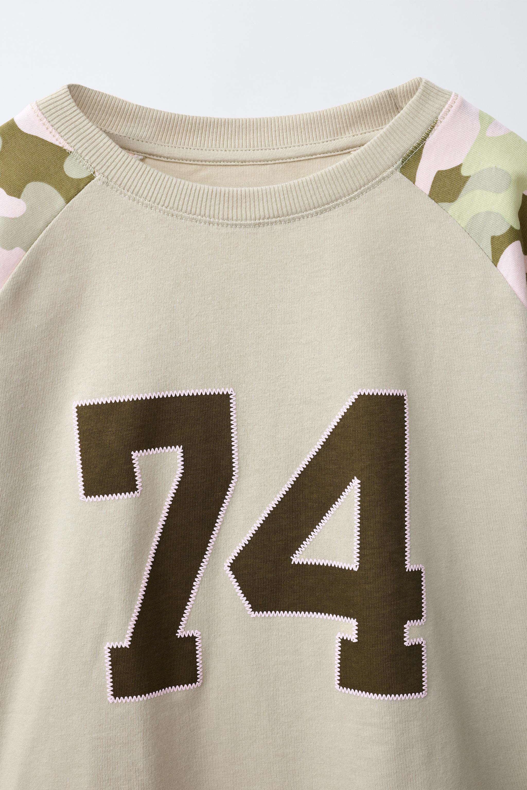 PRINTED RAGLAN SLEEVE T-SHIRT