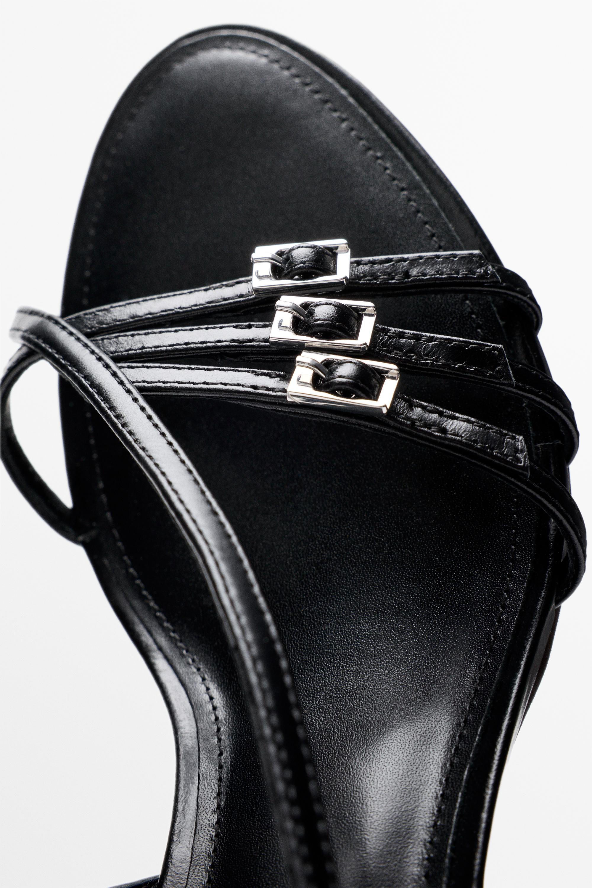 Leather heeled sandals with buckles