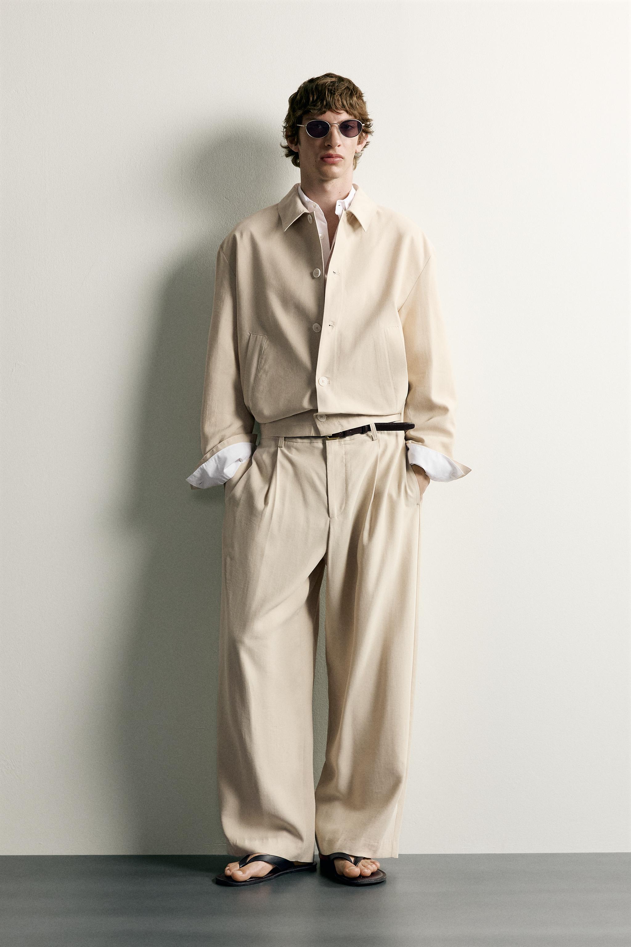 PLEATED RELAXED-FIT TROUSERS