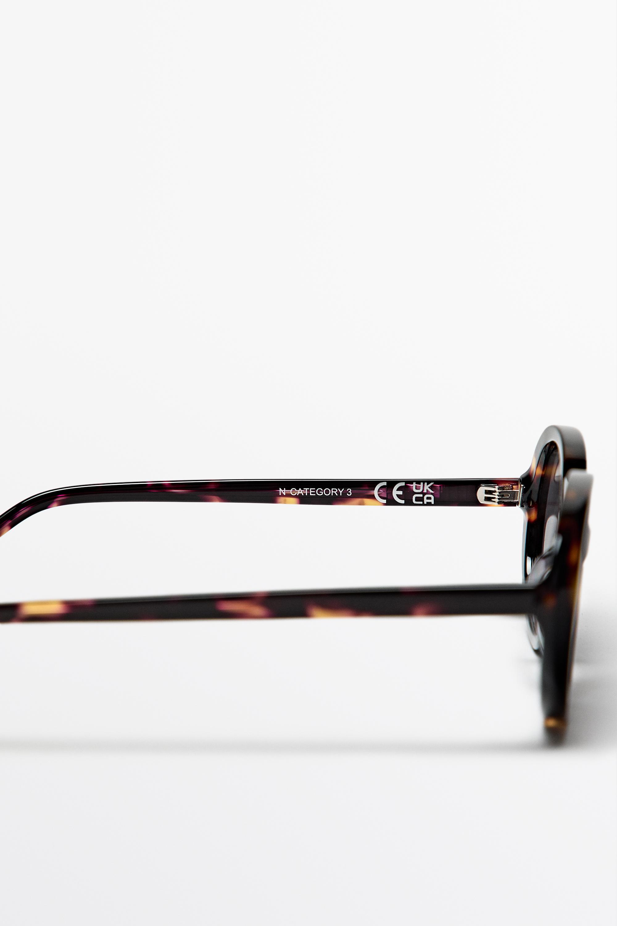 Oval tortoiseshell-effect sunglasses