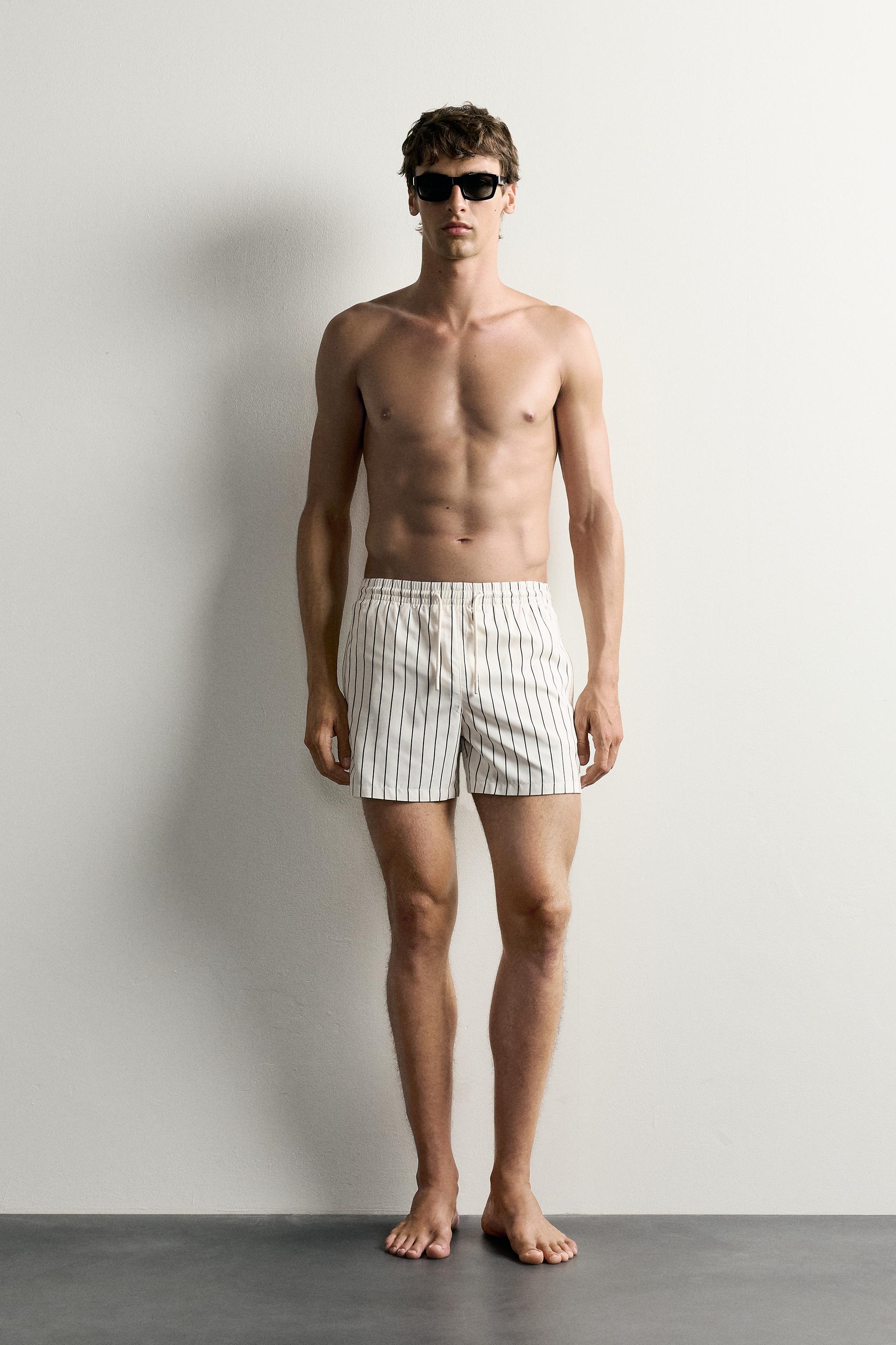 STRIPED MID-LENGTH SWIM TRUNKS