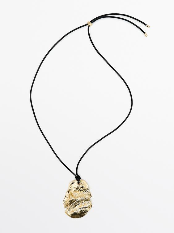 Leather cord necklace with fossil pendant from Zara - $100