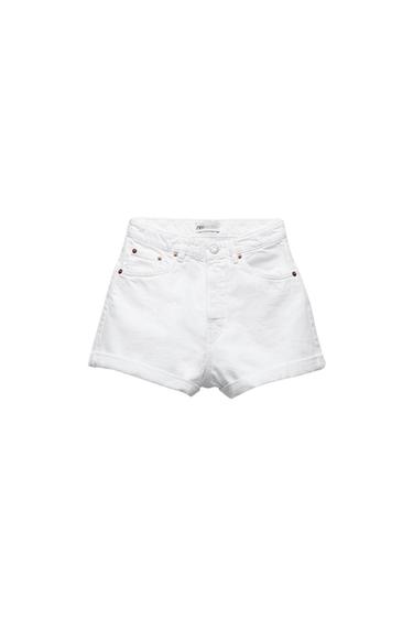 White denim shorts with front and back pockets, metal rivet detailing, and button closure. Visible label at the waist.