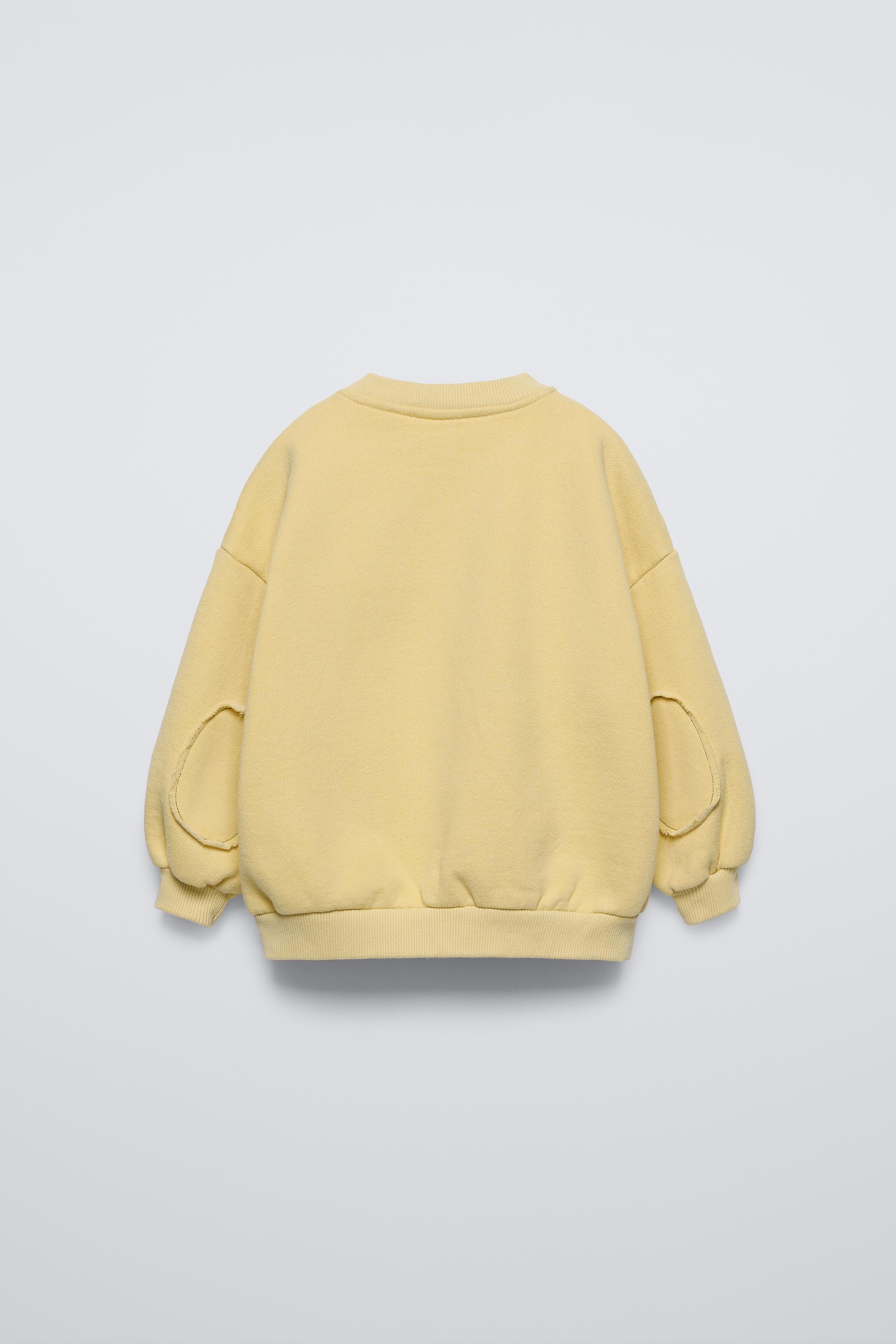 Pastel yellow sweatshirt on sale