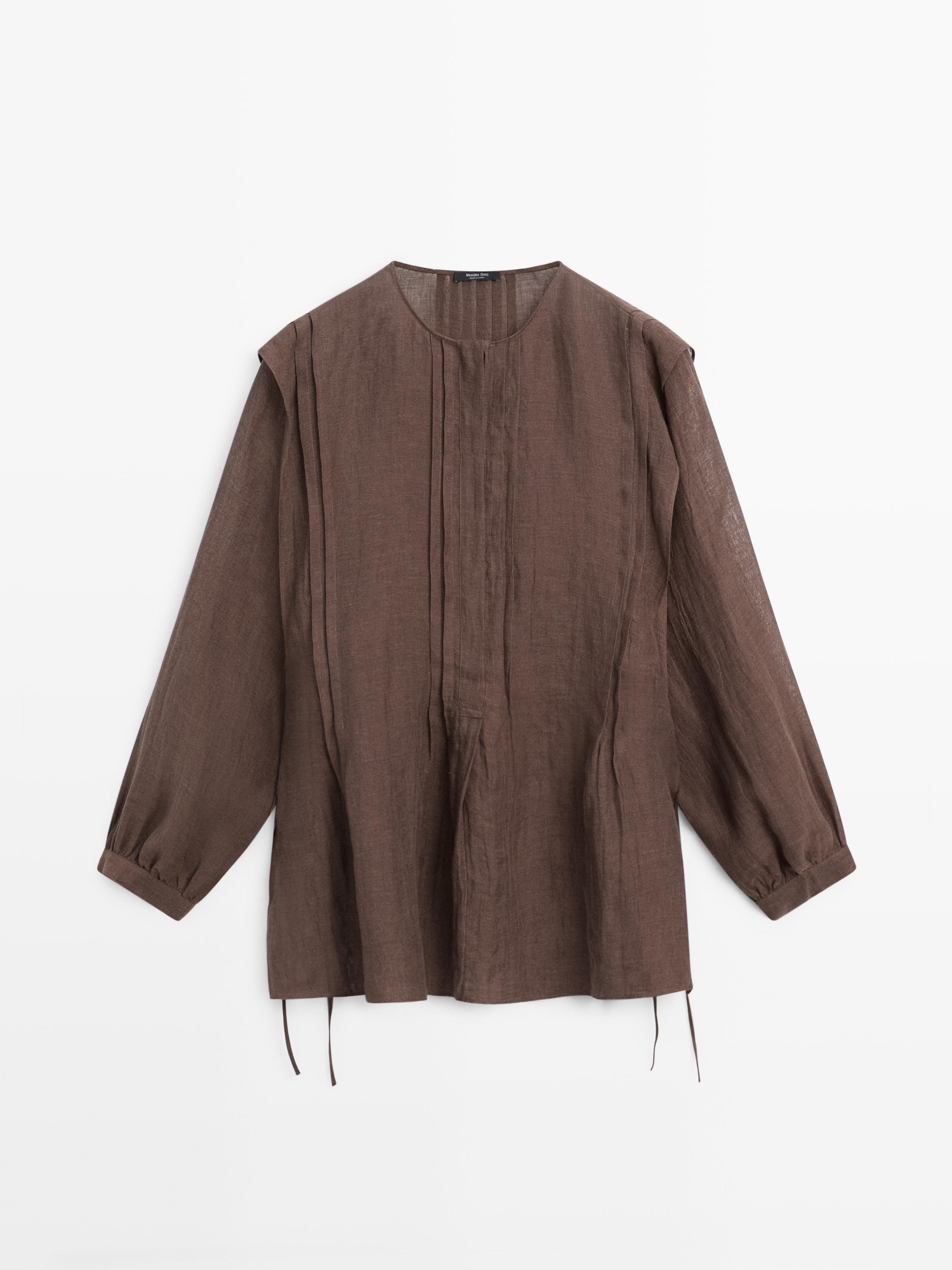 Flowing oversize linen blouse with ruffles