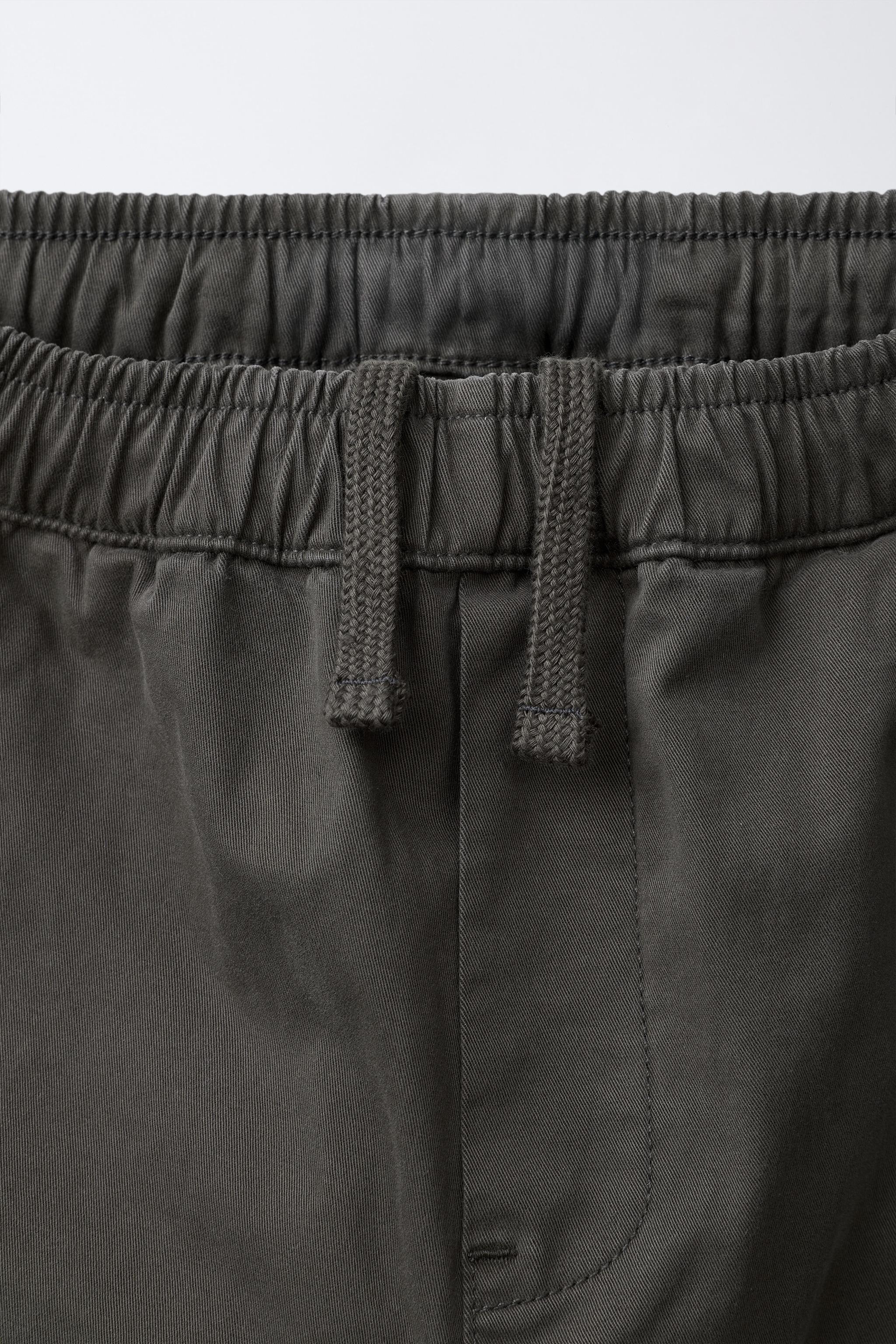 PLEATED STRAIGHT LEG PANTS