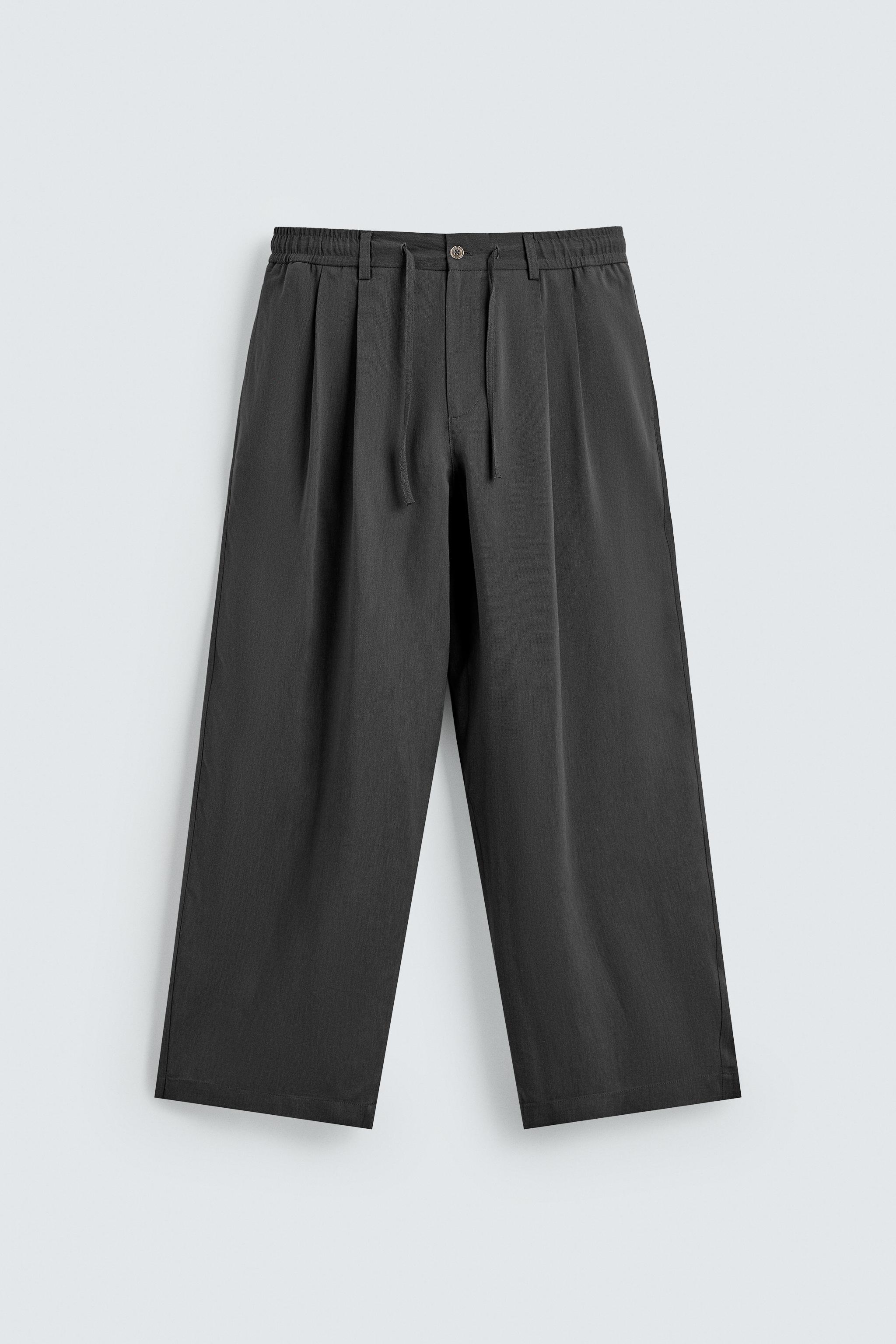 FLOWY PLEATED PANTS