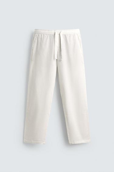 بنطلون RELAXED FIT قطن - كتان - أبيض مكسور الخاص بـ Zara