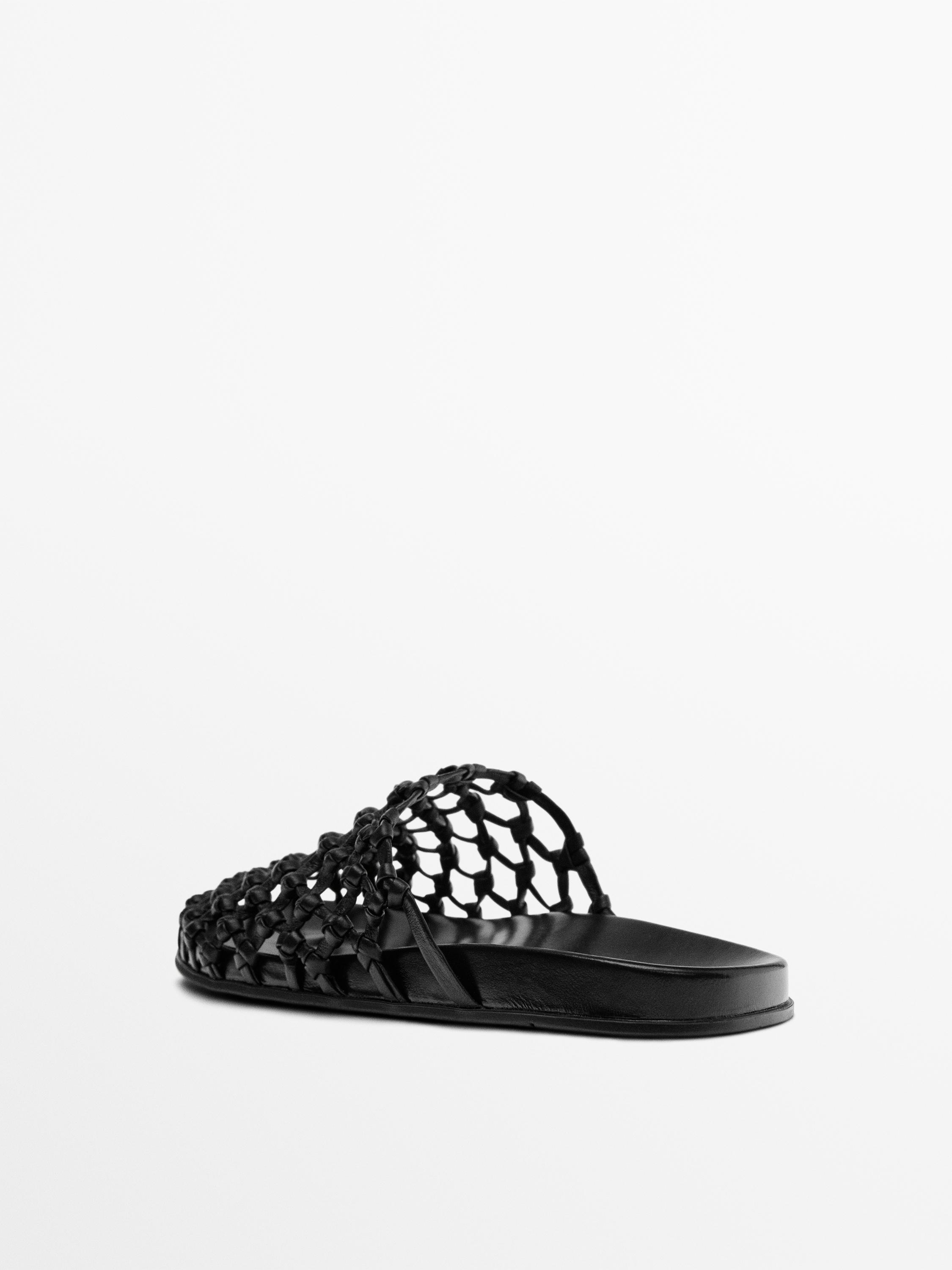 Woven leather clogs