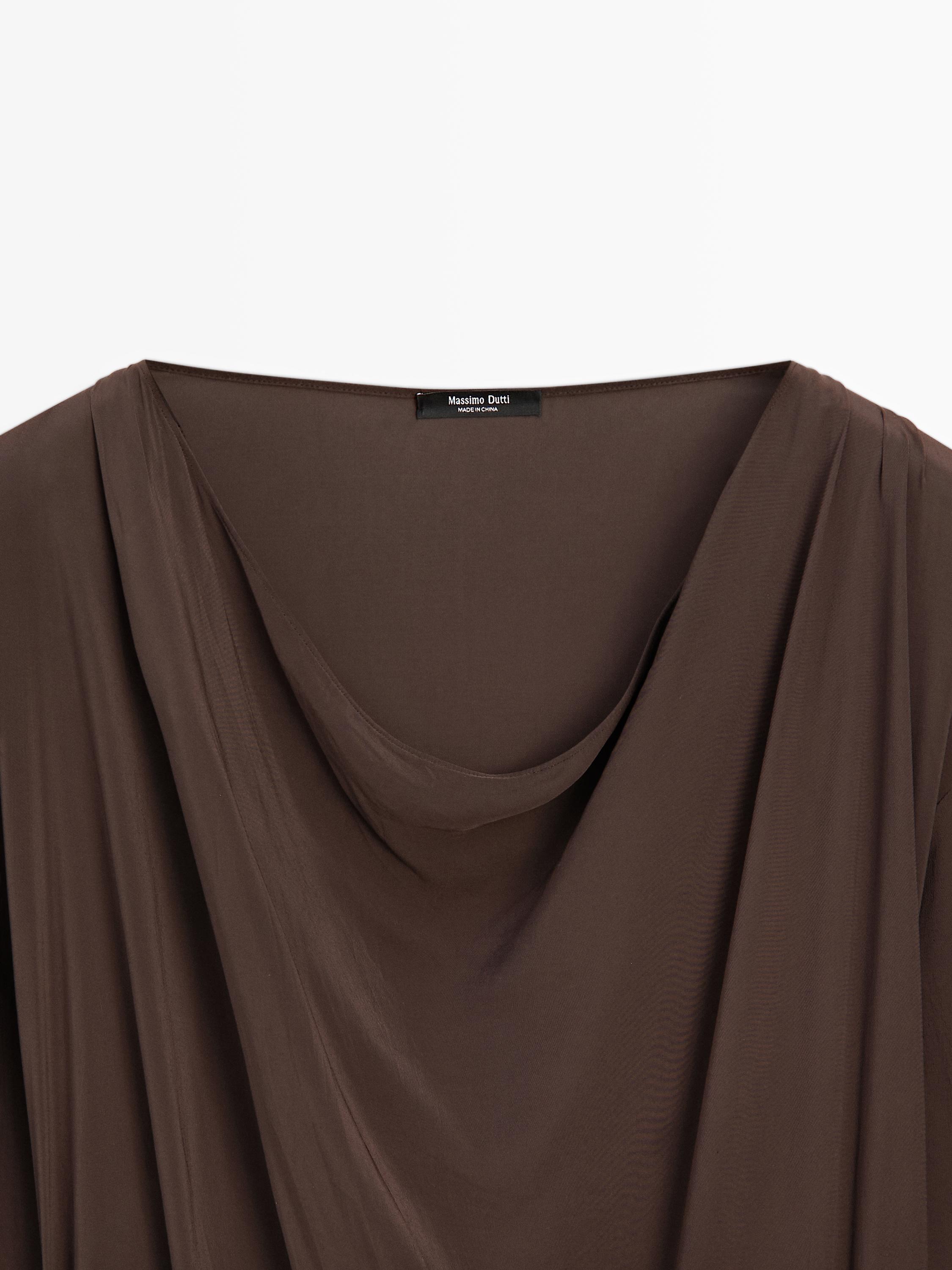 Long flowing dress with draped sash belt