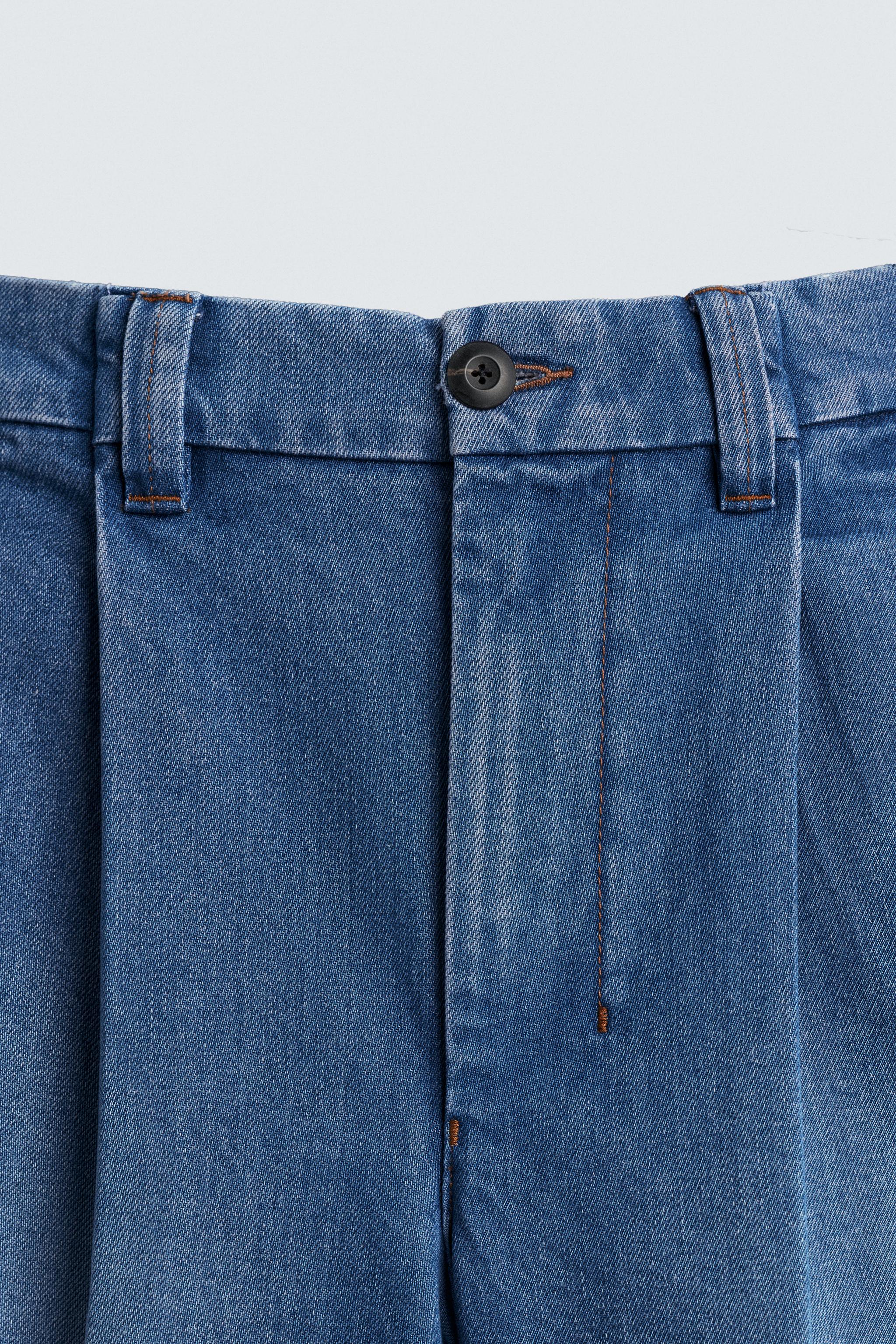 RELAXED FIT PLEATED DENIM SHORTS
