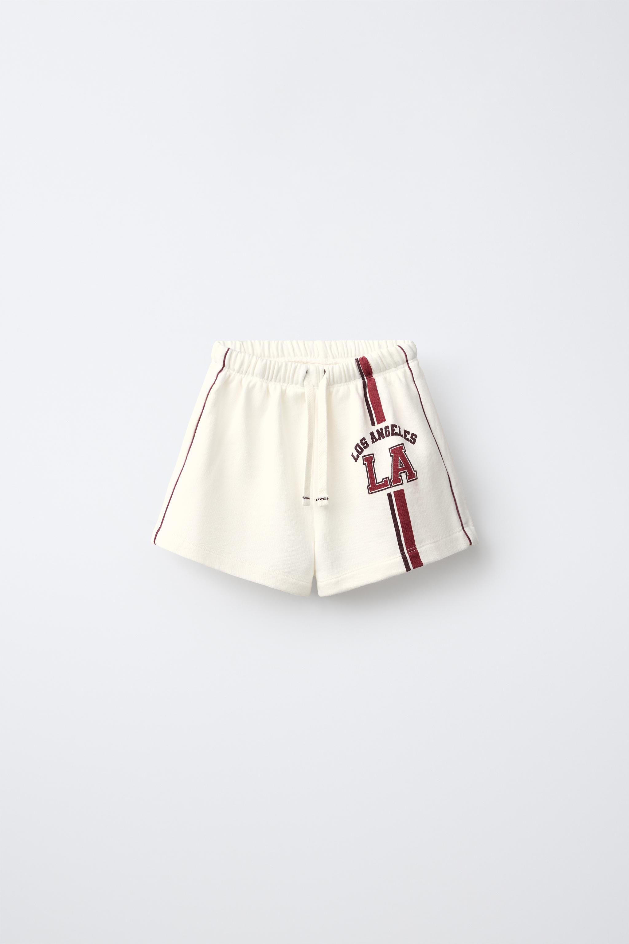 CONTRAST PIPING TEXT SHORTS — Ecru