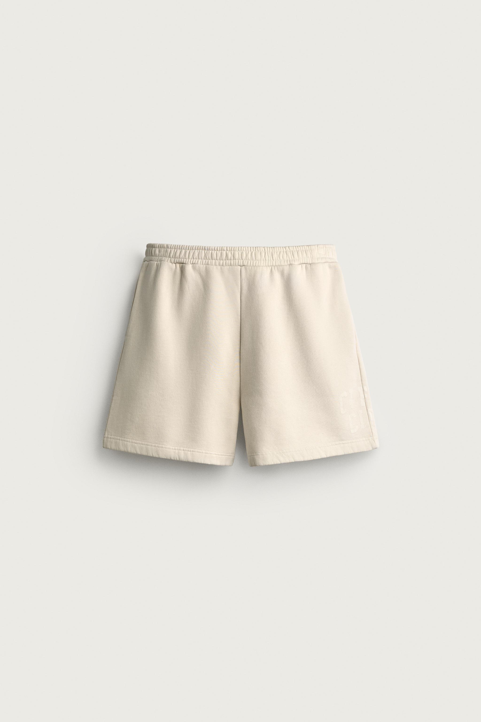WASHED TEXT PRINT JERSEY BERMUDA SHORTS — Ecru