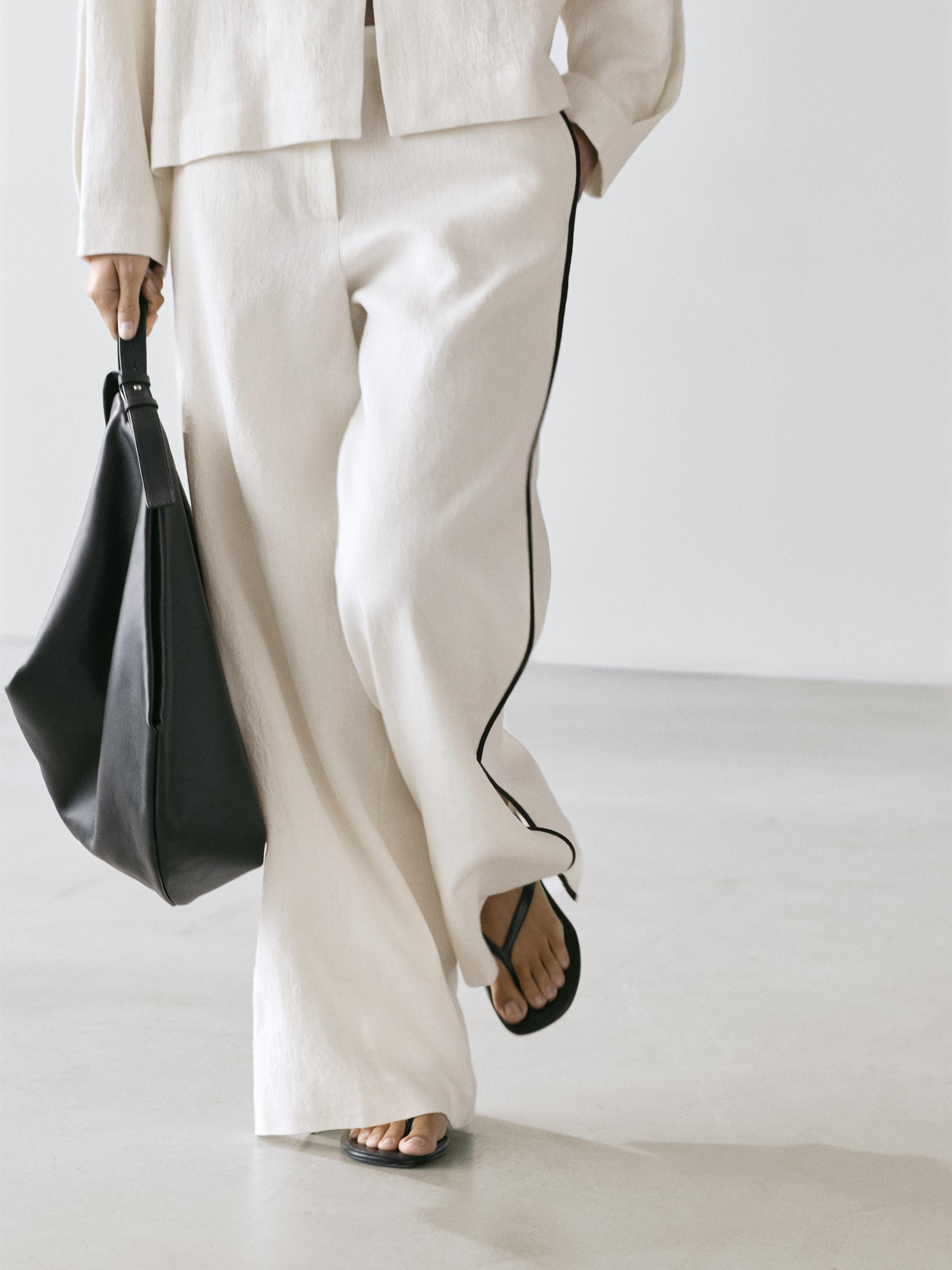 Linen trousers with contrast piping