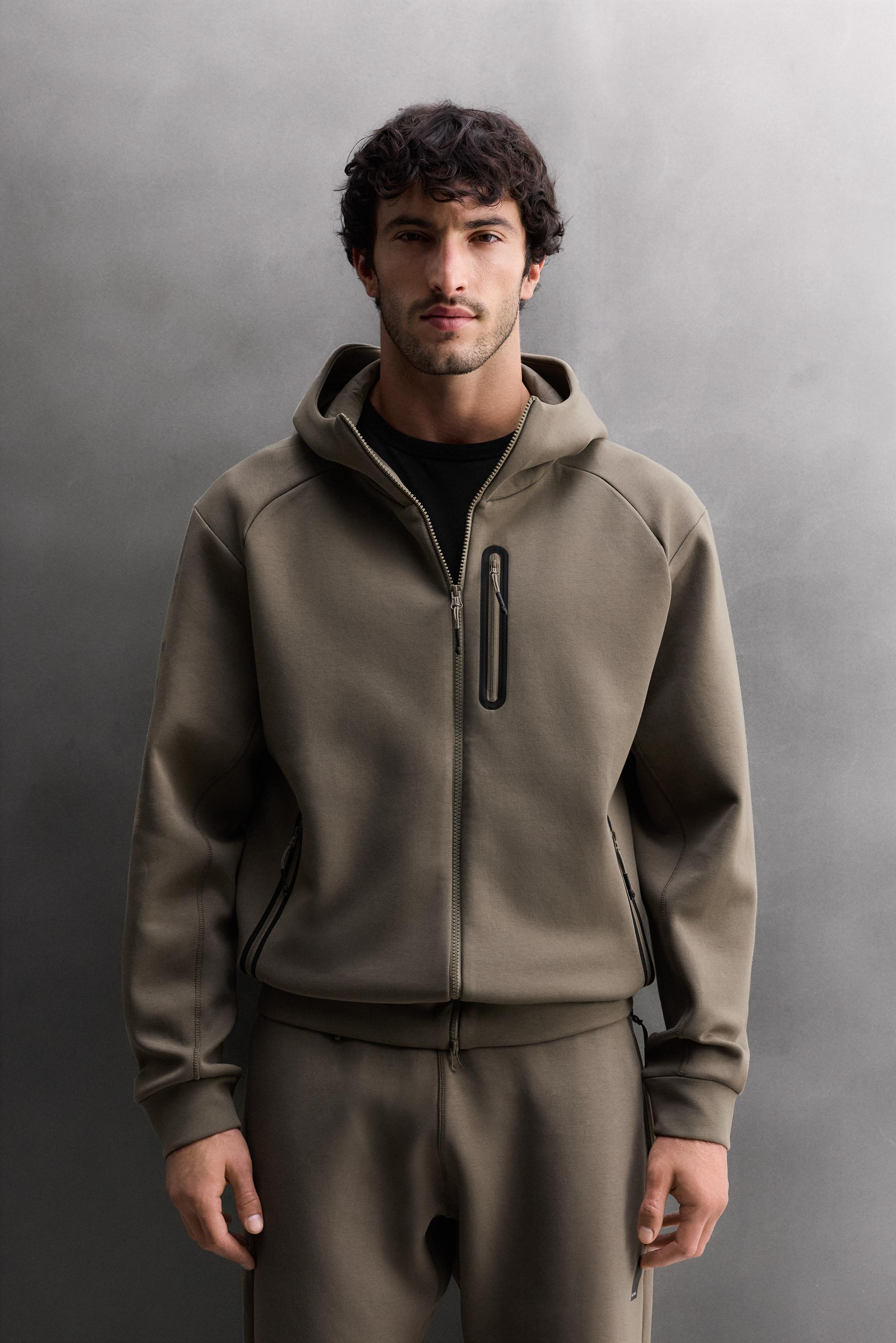 SWEAT TECHNIQUE ZIPPÉ À CAPUCHE