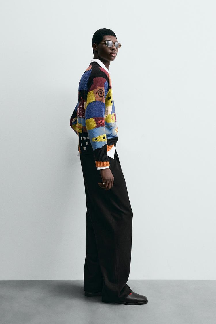 RELAXED FIT PLEATED TROUSERS