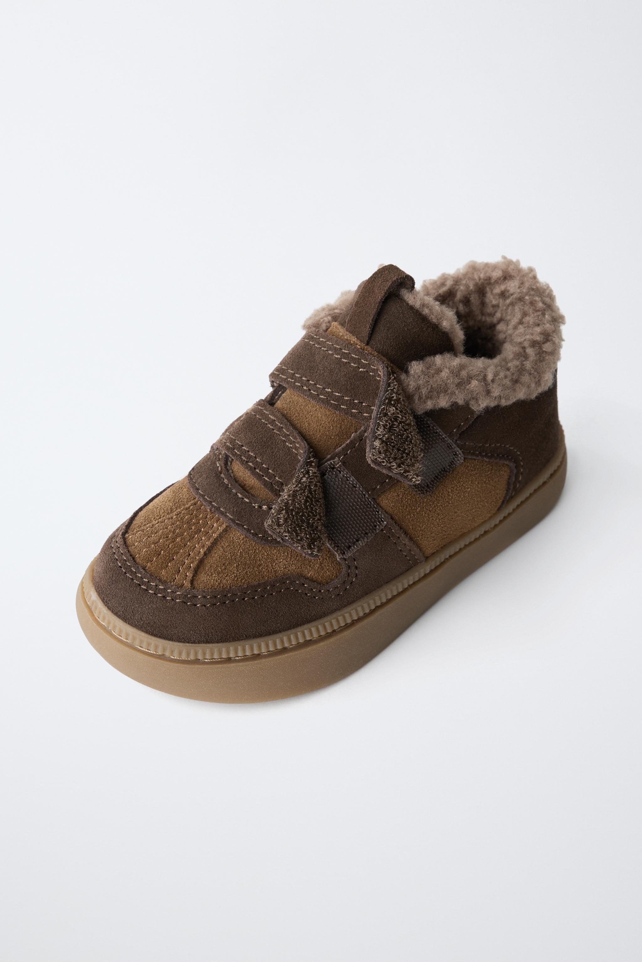 BASKETS MONTANTES EN CUIR
