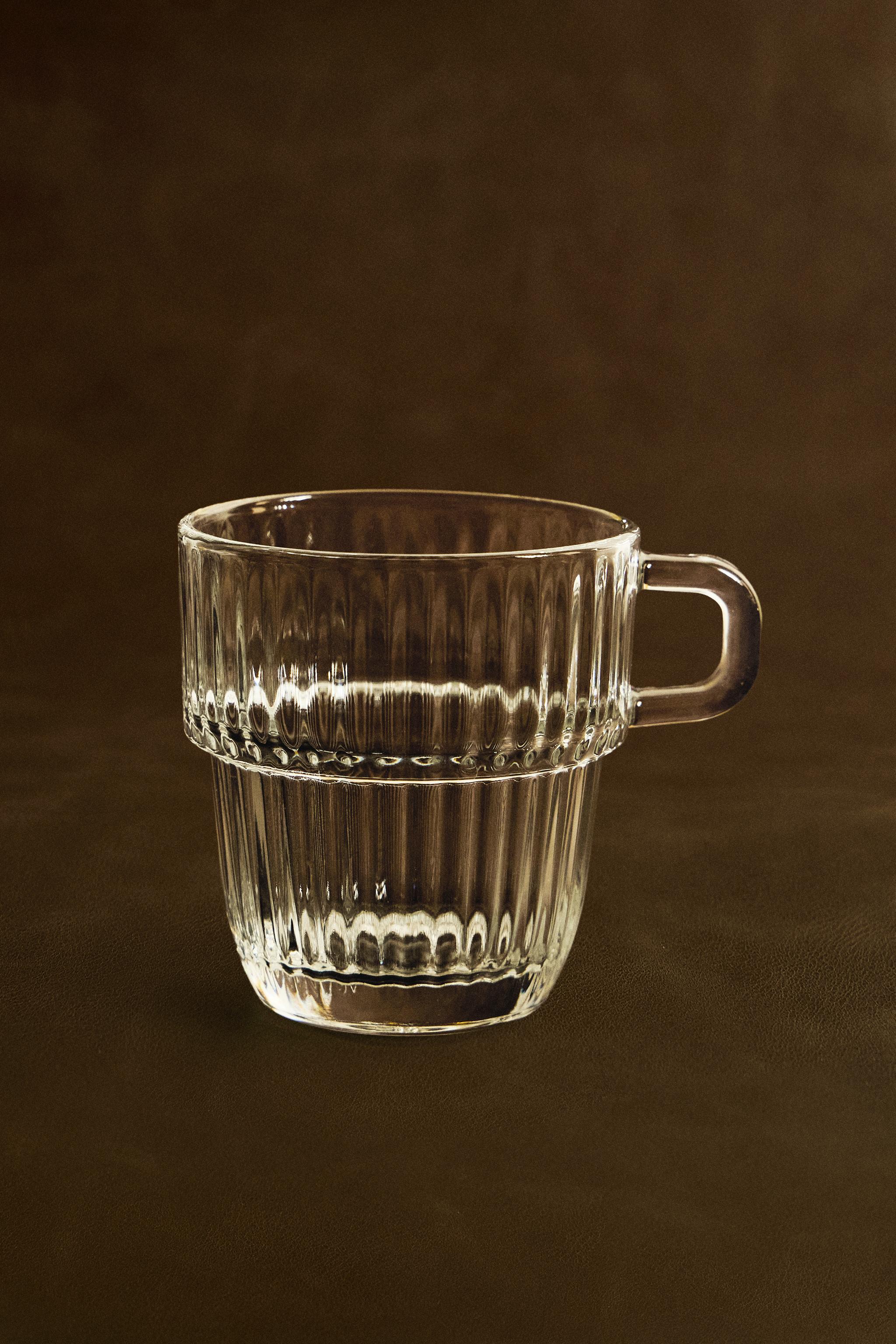 GLASS CUP WITH RAISED DESIGN