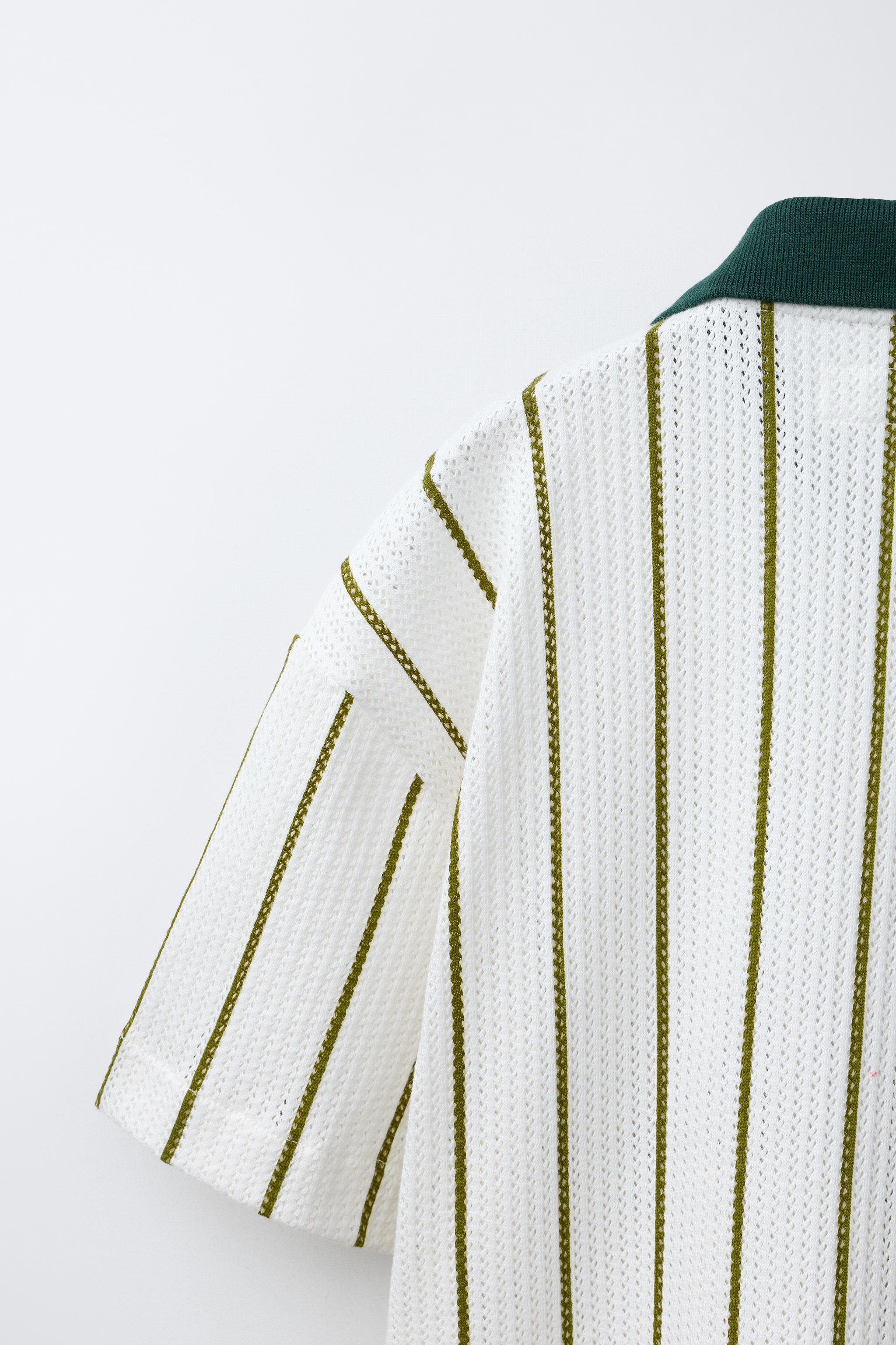 CHEMISE EN MAILLE À RAYURES AVEC INSCRIPTION