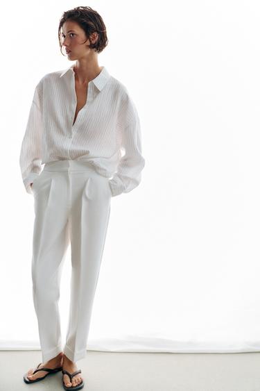 PANTALÓN PLIEGUES VUELTA BAJO - Blanco de Zara