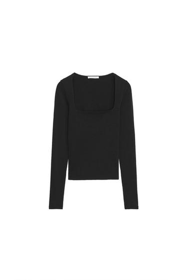 Front view of a fitted black t-shirt with a square neckline and long sleeves.