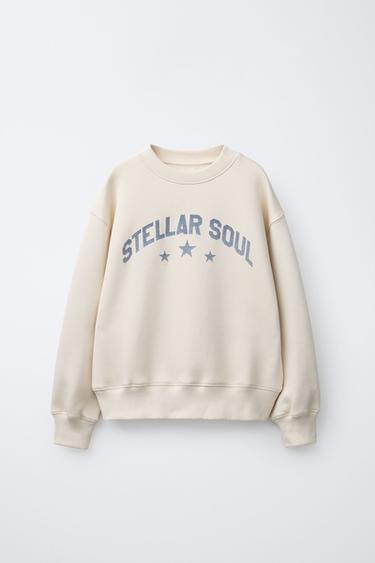 SUDADERA ESTAMPADO ESTRELLAS BRILLO  - Crudo de Zara