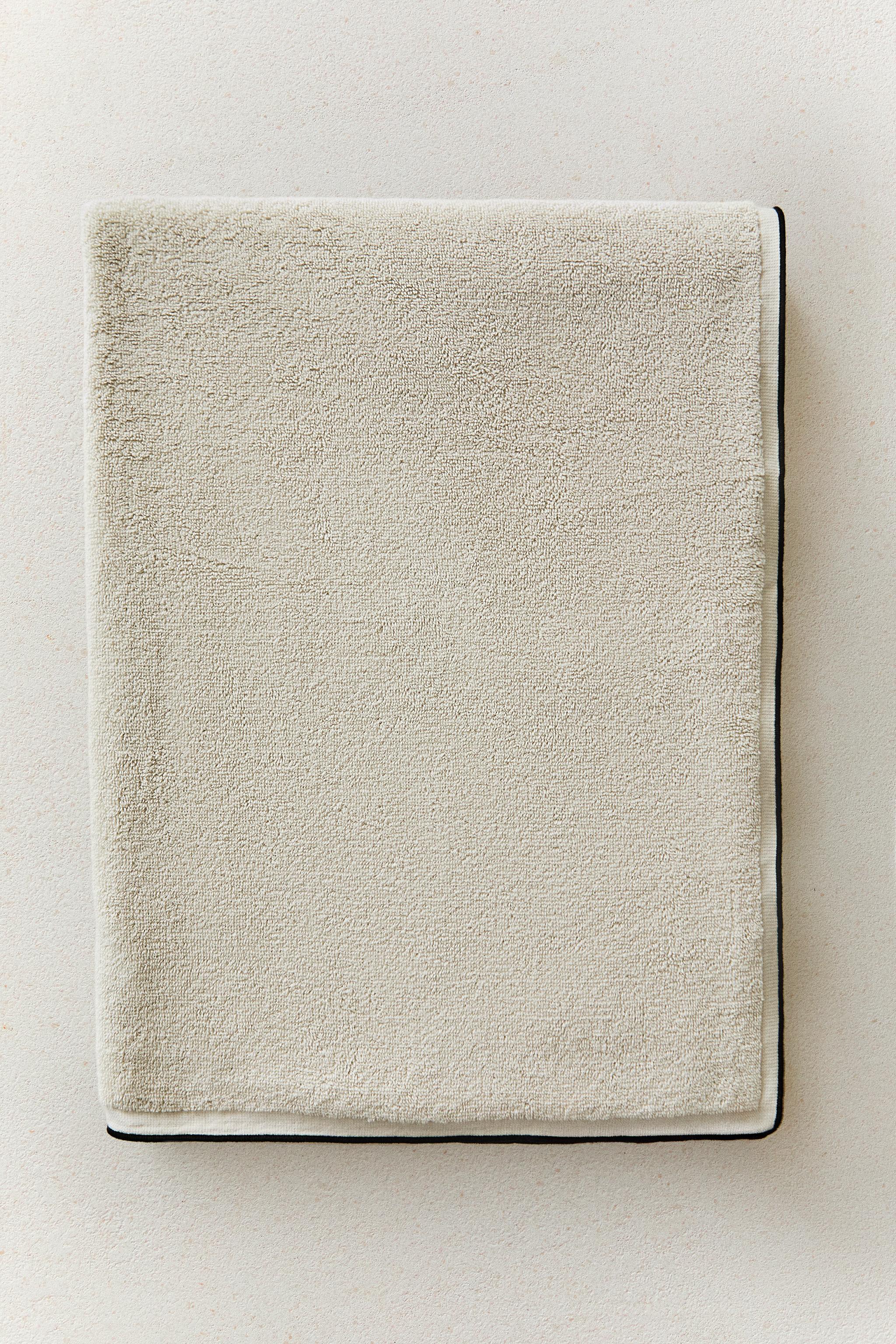 SERVIETTE DE BAIN COTON SURPIQÛRES ET PASSEPOIL