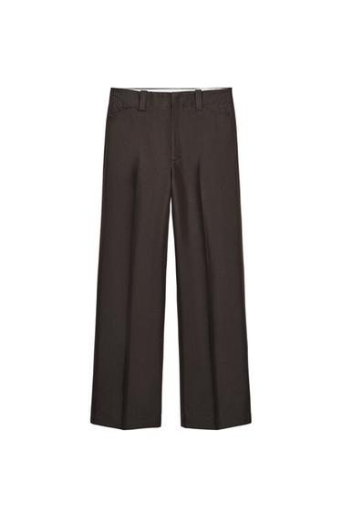 Front view of brown pants with belt loops and side pockets.