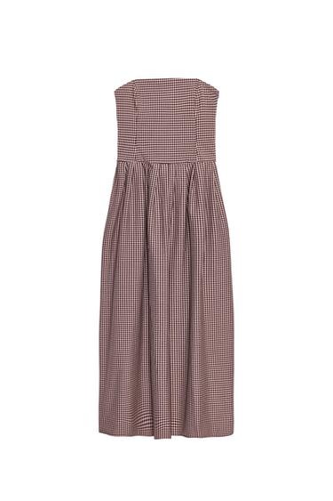 Front view of a dark pink, strapless midi dress with a gingham check pattern and pleats. Concealed side zip fastening.