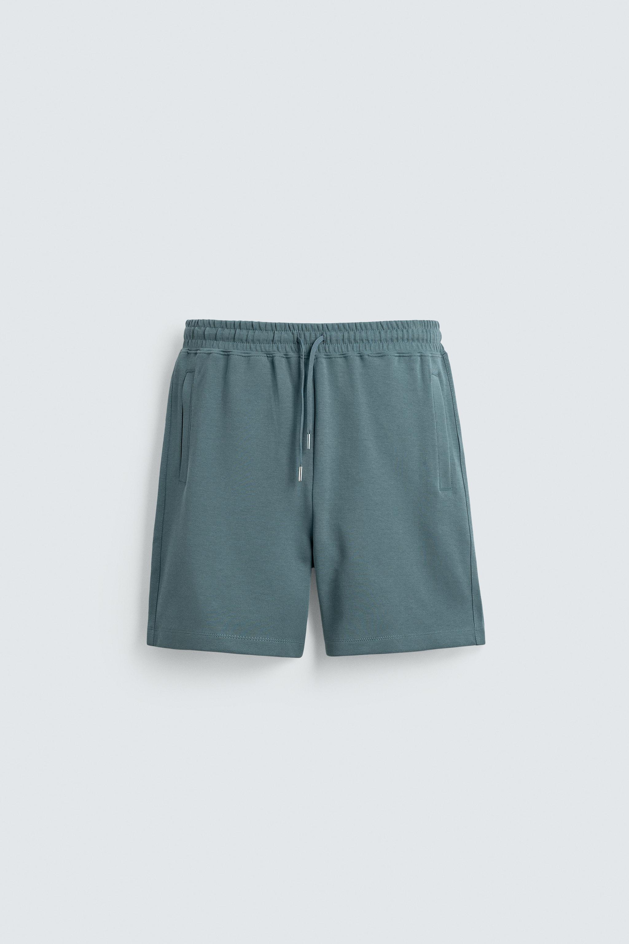RELAXED FIT INTERLOCK JOGGER BERMUDA SHORTS — Duck blue