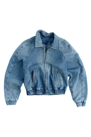 Front view of light blue bomber jacket with shirt collar, zip closure, welt pockets, and elastic cuffs.