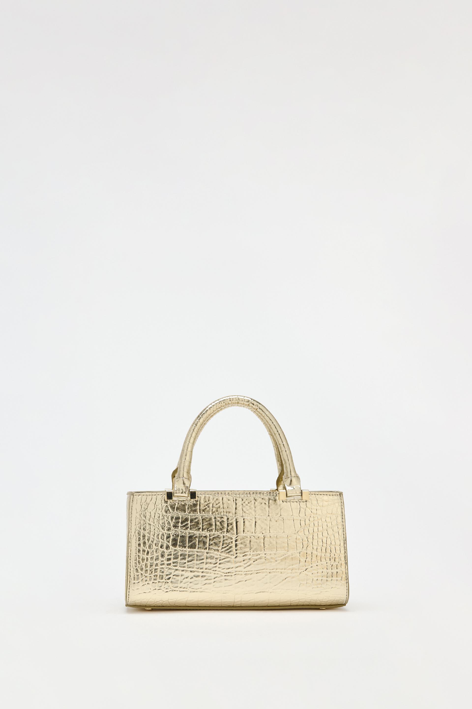 Gold mini handbag hotsell