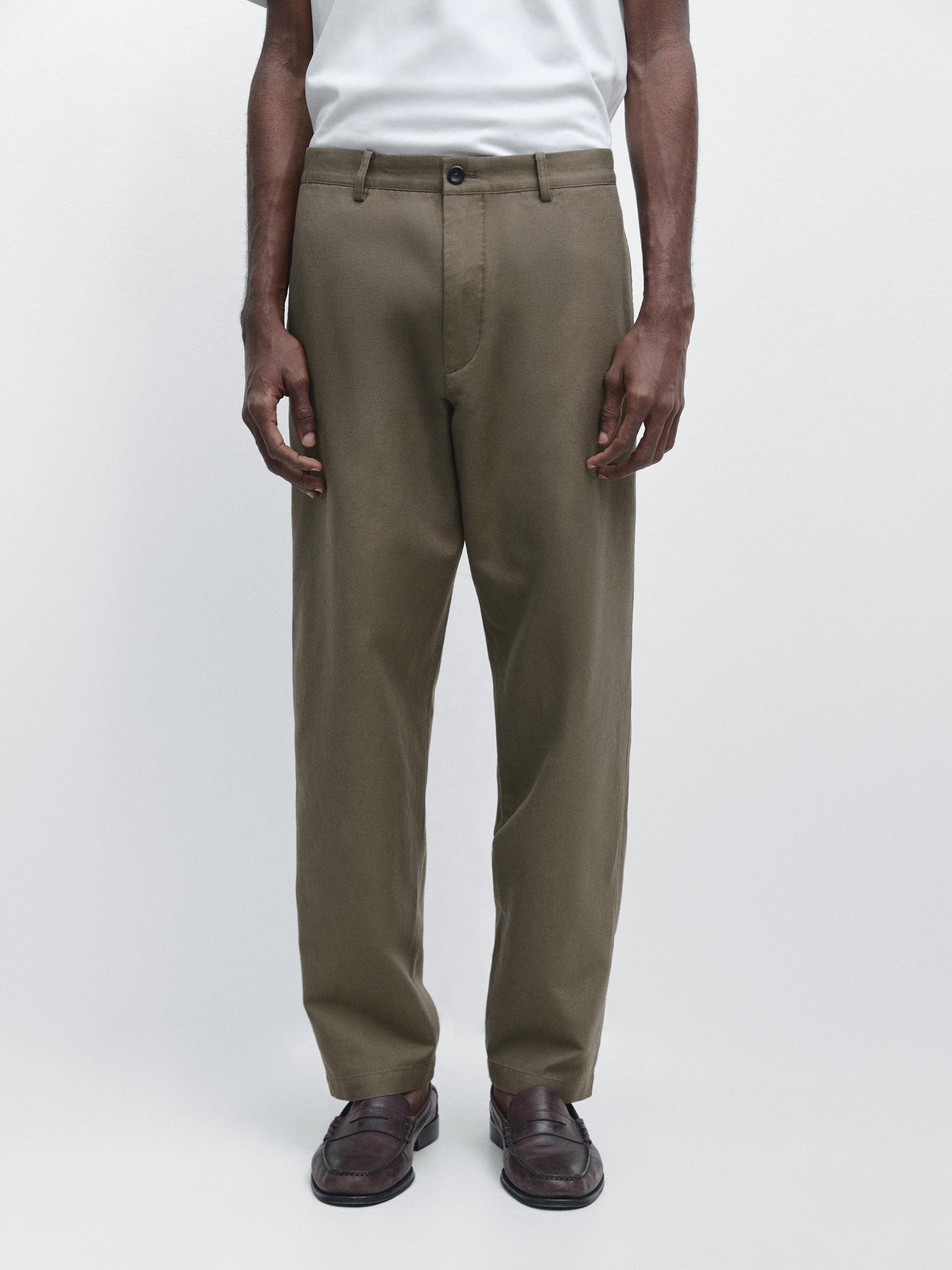 Cotton and linen tapered fit trousers — Black gold