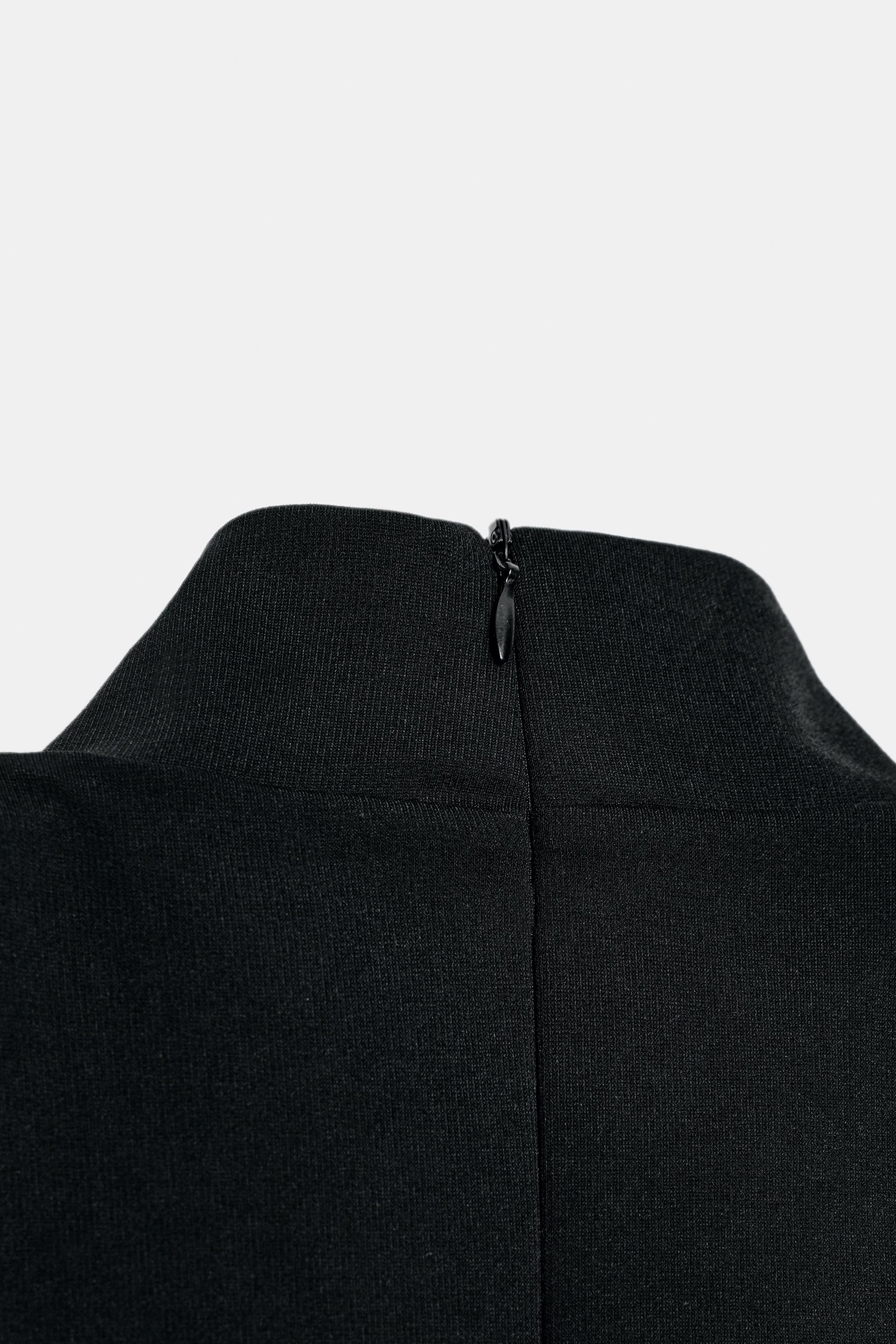 TOP PÉPLUM SANS MANCHES