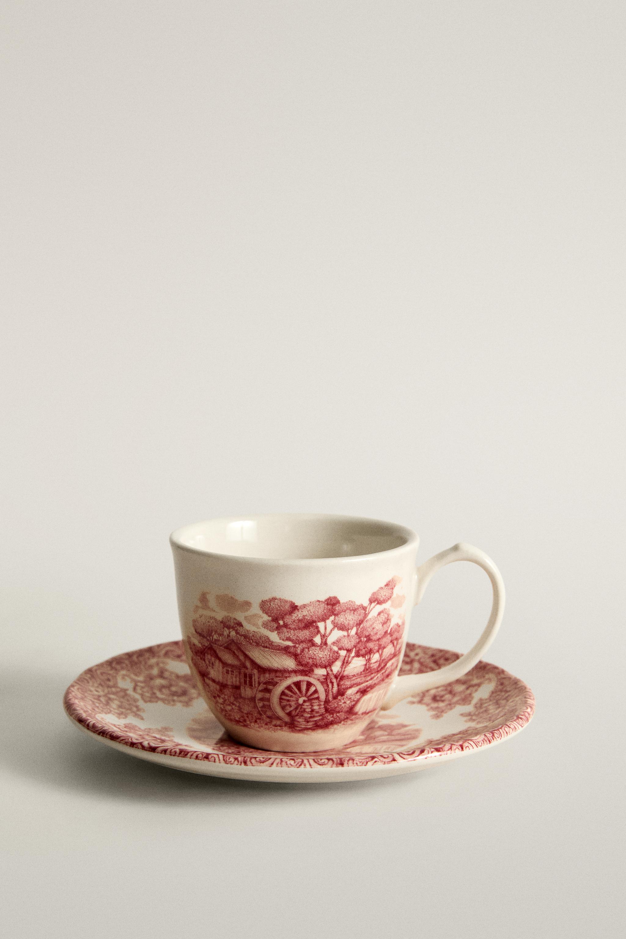 FLORAL AND LANDSCAPE EARTHENWARE COFFEE CUP AND SAUCER SET