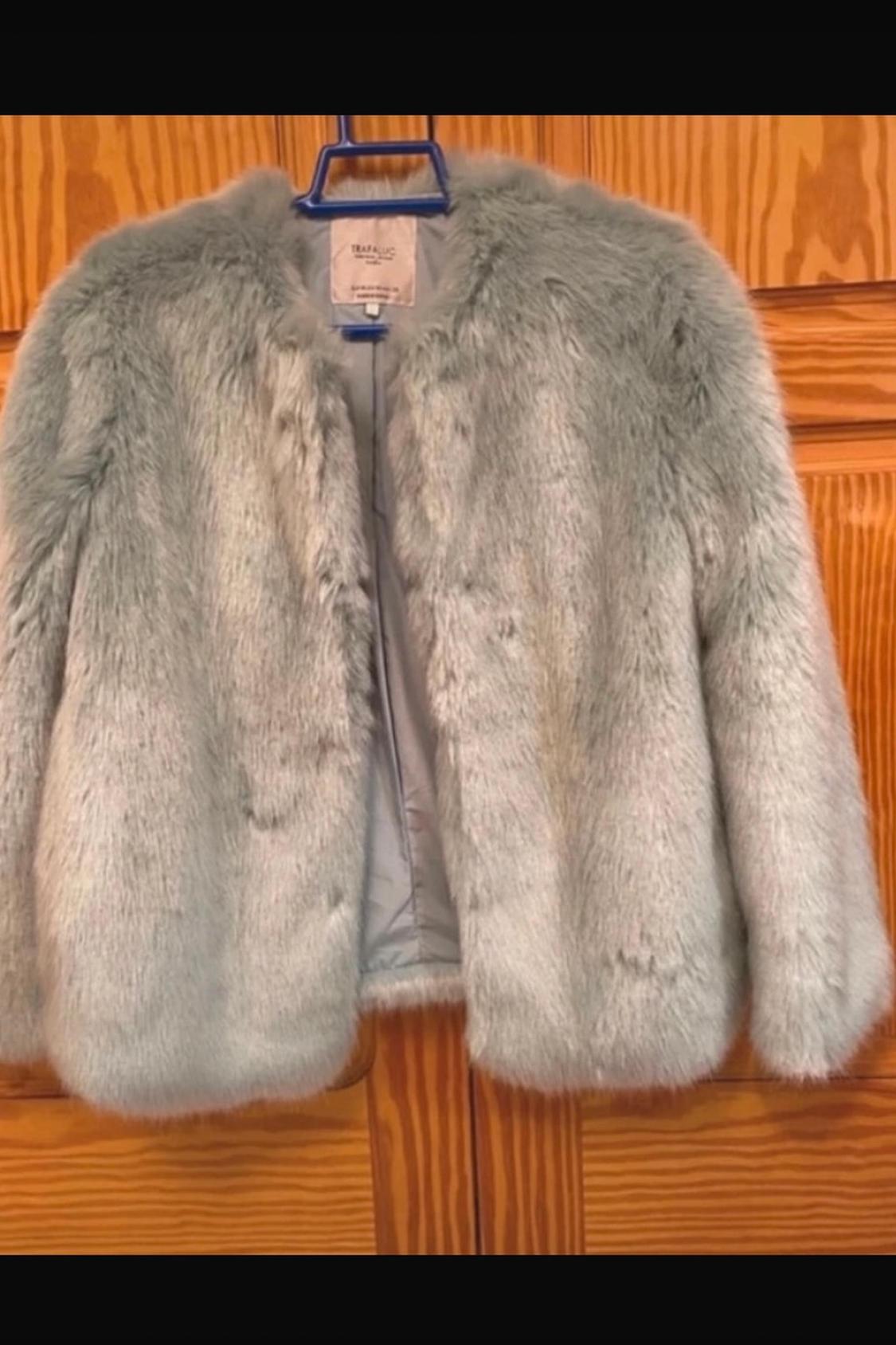 Front view of grey fur jacket with round neck and long sleeves.