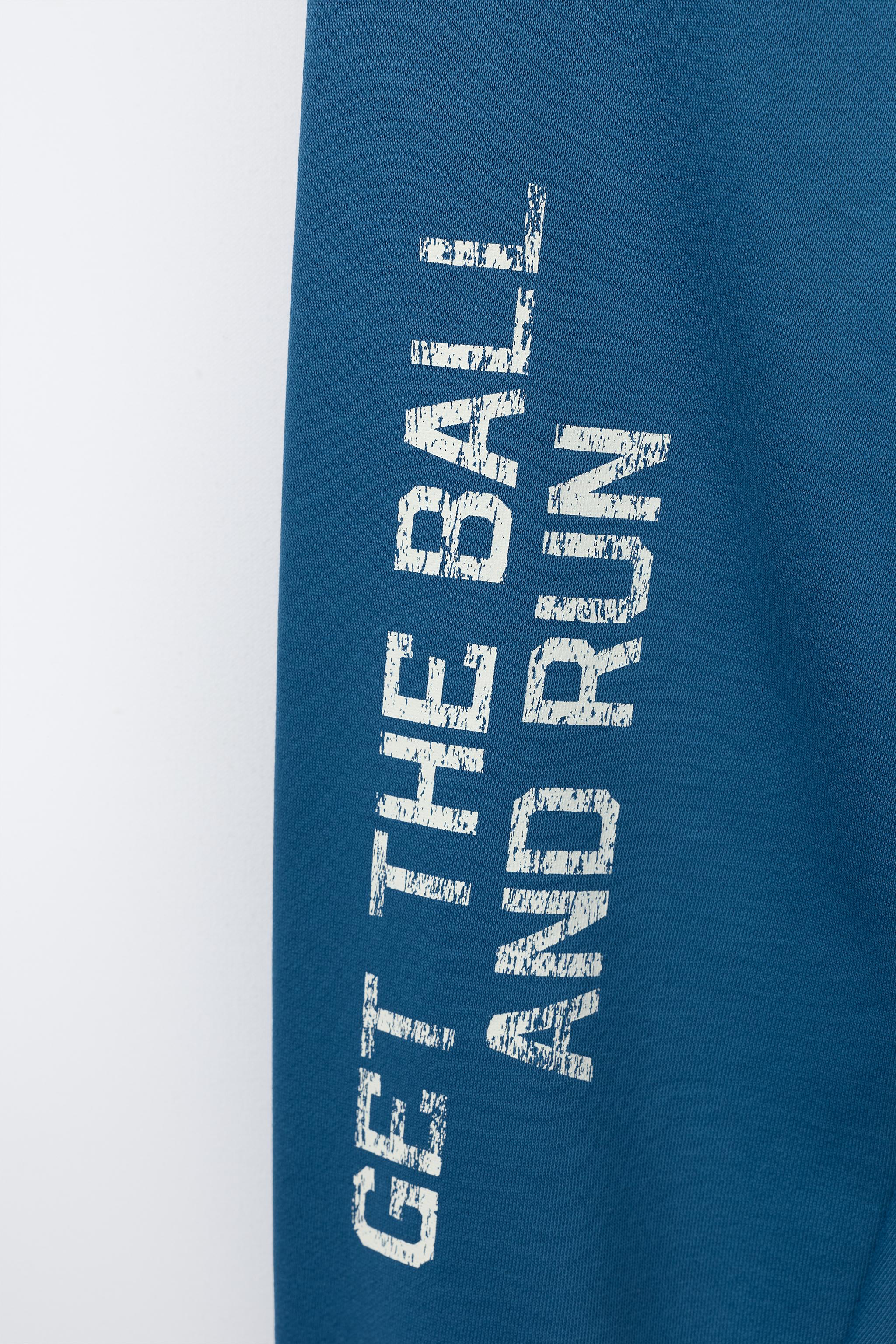 PANTALON DE JOGGING AVEC INSCRIPTION ET ÉTIQUETTE