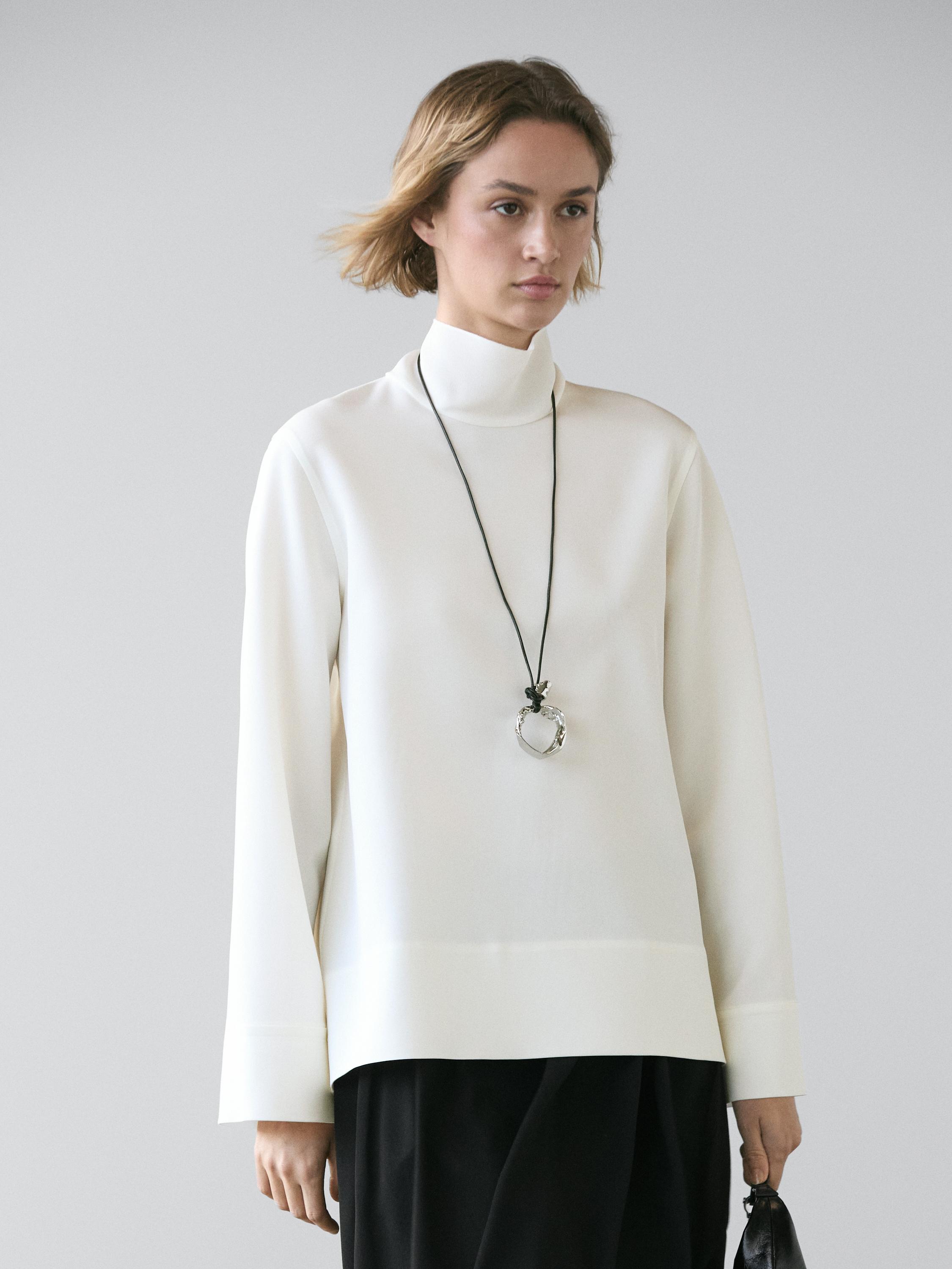 High neck blouse with hem detail