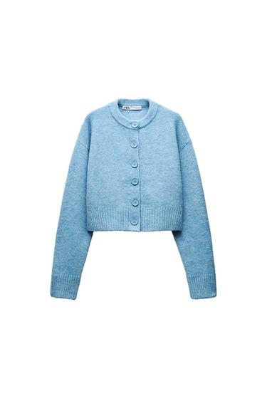 Front view of a light blue cardigan with large buttons and a round neck.