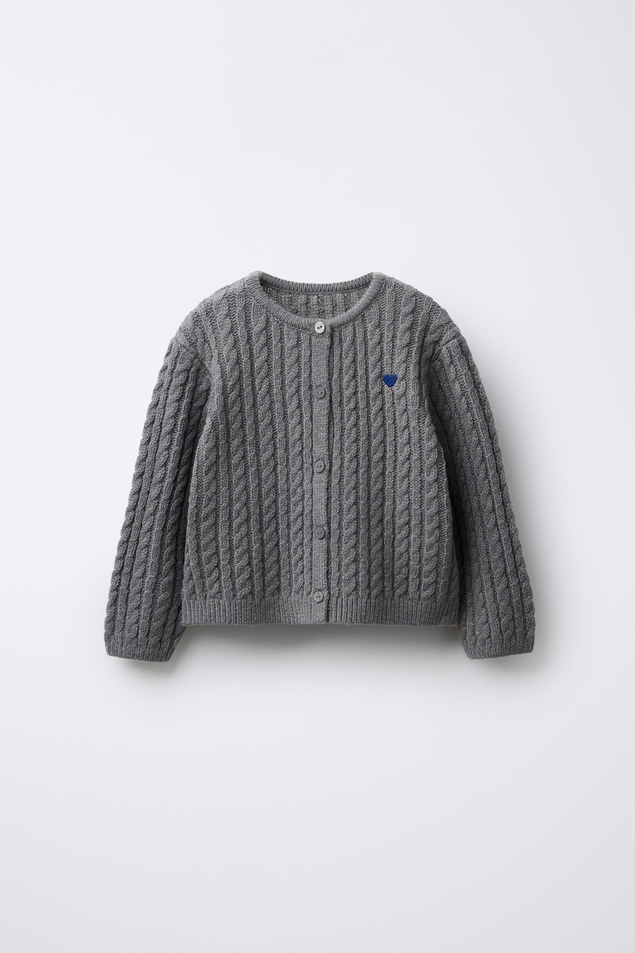 GILET EN MAILLE TORSADÉE BRODÉ AVEC LAINE