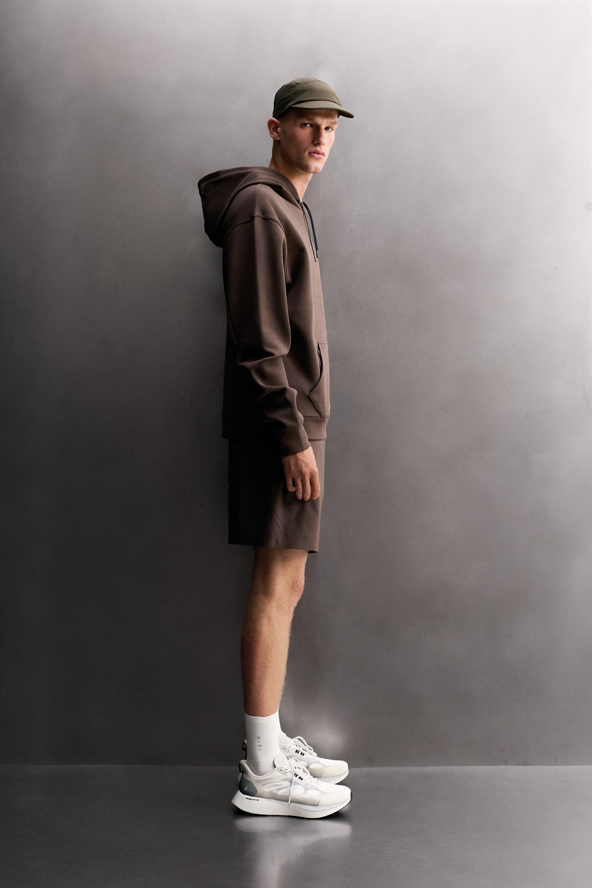 SWEAT TECHNIQUE À CAPUCHE