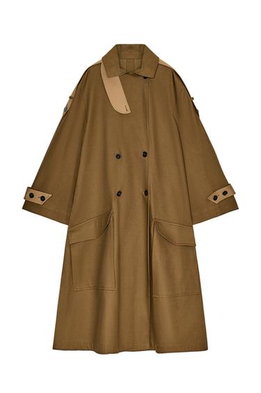 Front view of a mid-length camel trench coat with a funnel neck, long sleeves with tabs, patch pockets, and a double-breasted fastening.