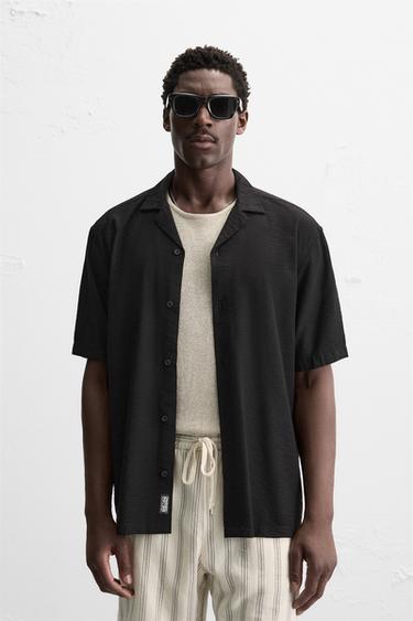 قميص منسدل RELAXED FIT - أسود الخاص بـ Zara