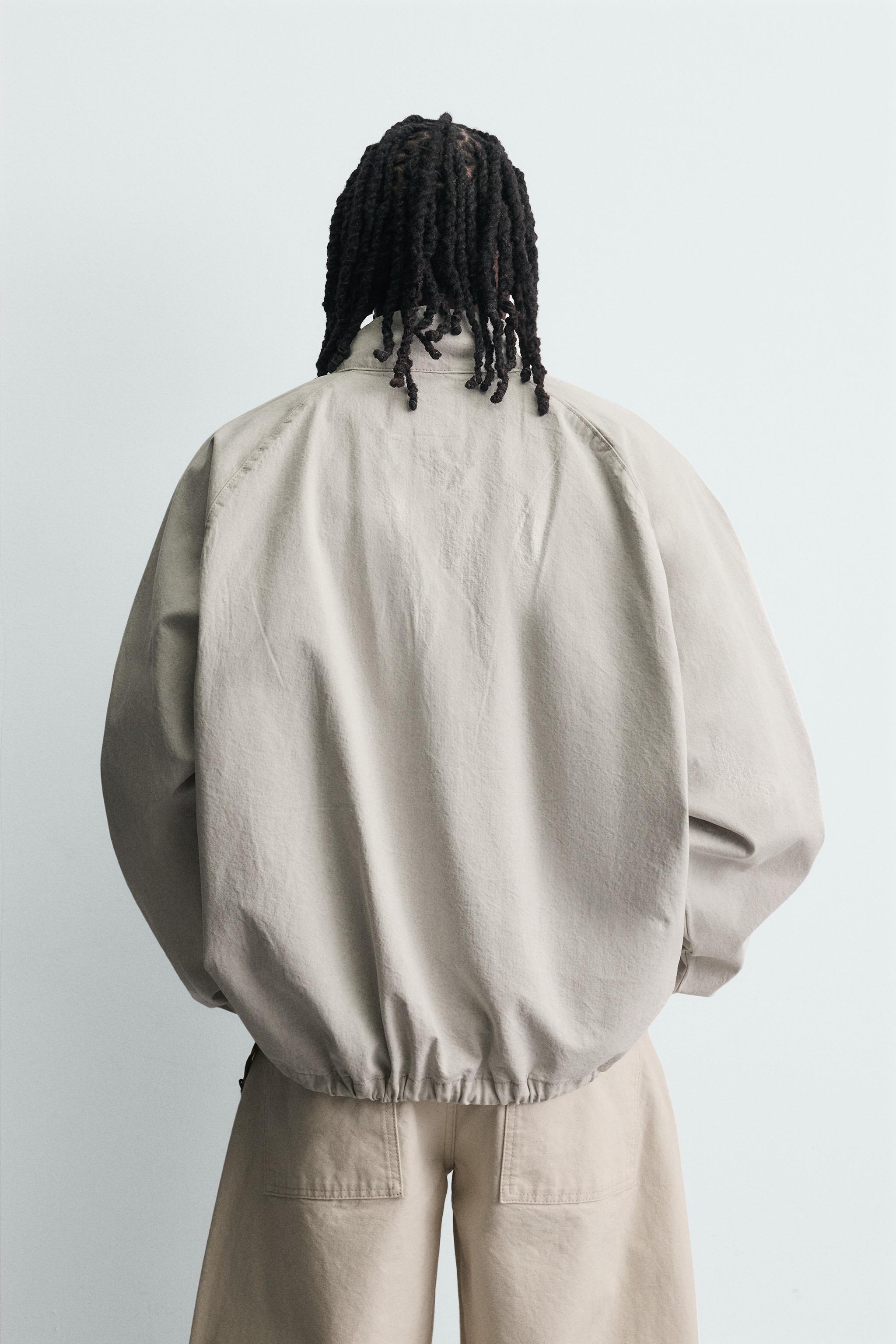 ZIPPERED POUCH POCKET SWEATSHIRT